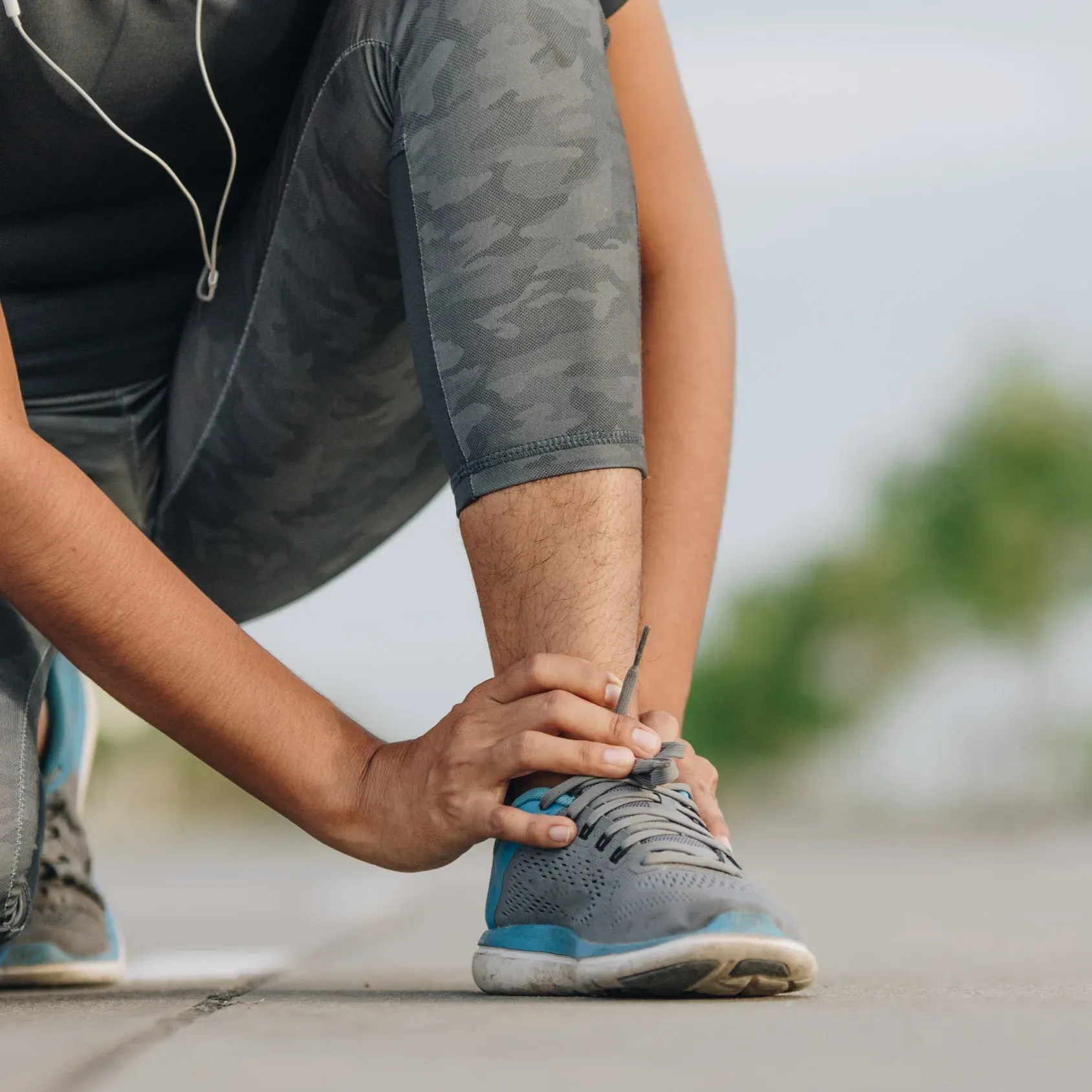 person suffering from foot and ankle pain