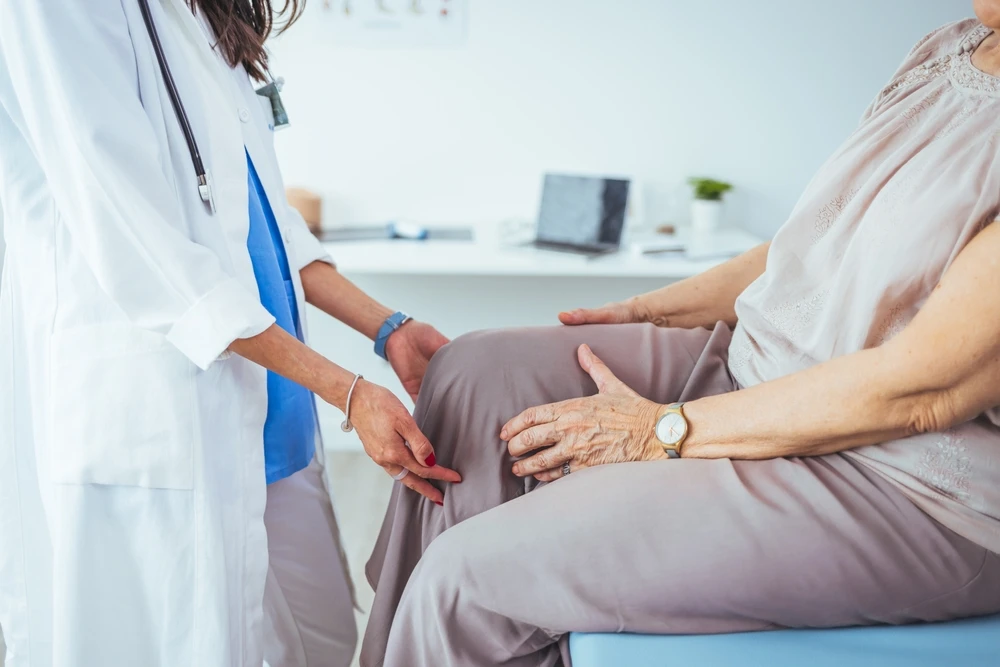 Knee pain treatment specialist examining patient in Millburn, NJ