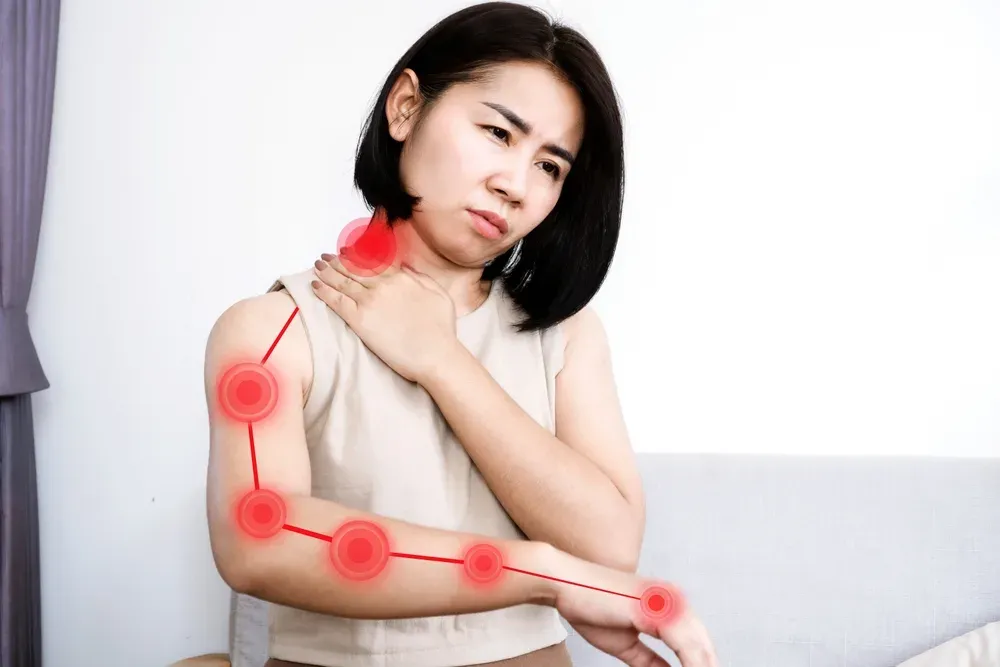 woman suffering from nerve pain in her arm