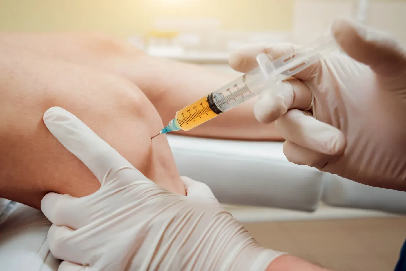 Physician performing a regenerative injection